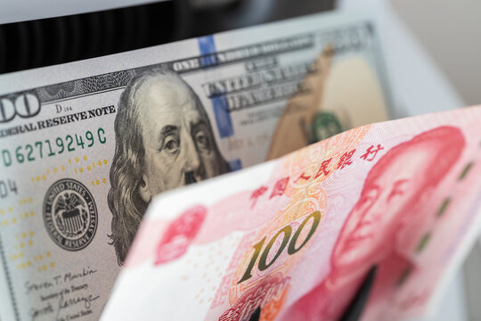 The exchange rate of the US dollar to the Chinese Yuan. Economic concept, Financial analysis. reductions and interest rate increases, Central market control