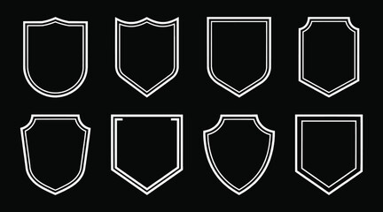 Collection of minimalist white outline shield shapes on black background featuring classic and modern frame styles perfect for logo design, branding, security icons, and badge templates