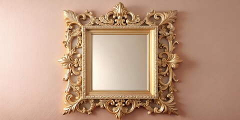 Large ornate gold mirror placed on a soft blush pink wall with elegant wooden frame and intricate carvings
