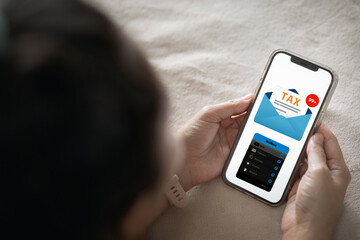 Person looking at smartphone showing TAX email notification in his inbox