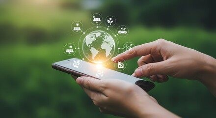 Person using a smartphone with green energy icons floating around a digital globe on the screen display