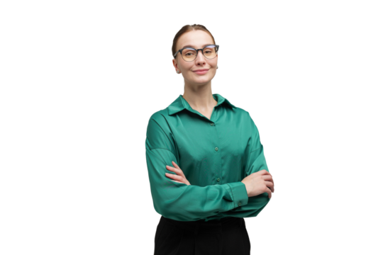 Confident business professional posing with folded arms in a stylish green blouse in a bright studio setting empty background