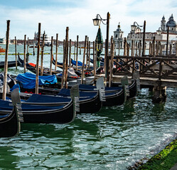 Gondolas Docked on the Grand Canal with View of Santa Maria della Salute – Classic Venice Travel Image © Thomas