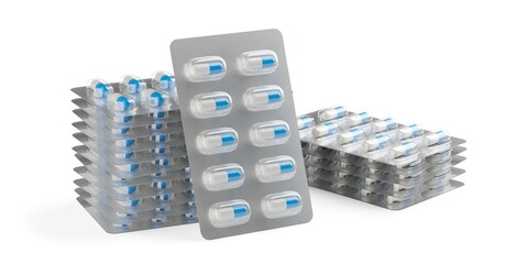 Two stacks of blue and white pill capsules in pill blister pack, one leaning in front on white background, medication, pharmacy or drug concept