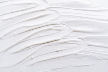Smear of white cream texture on a white background , Body lotion for perfect skin