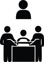 Three people interacting at a desk one person standing above representing teamwork communication and collaboration in a business setting