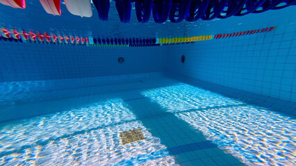 Swimming pool with handrail. Stainless steel ladder in pool