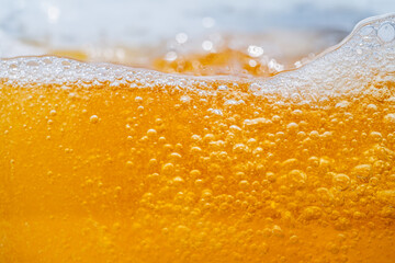 Close up bright orange Oil or beer splash texture and nature waves, Beautiful waves curve and...