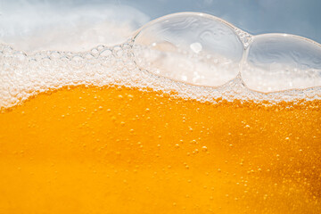 Close up bright orange Oil or beer splash texture and nature waves, Beautiful waves curve and...