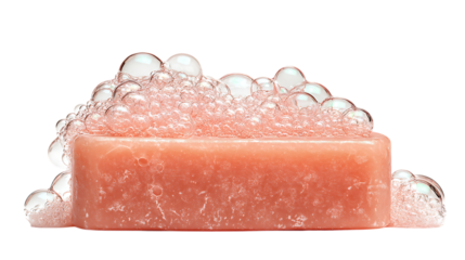 A bar of pink soap covered in bubbles against a black background view on transparent background