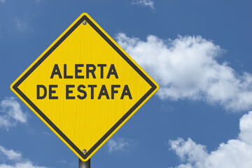 Scam Alert Alerta de Estafa yellow warning sign with sky