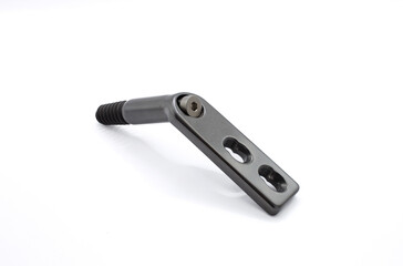 A dynamic hip screw (DHS) on the white background, also known as a sliding hip screw, is an orthopaedic implant used to fix certain types of hip fractures, particularly those in the femoral neck
