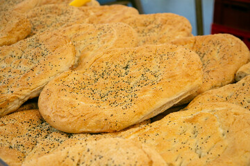 Selling a variety of Turkish breads at the Kreuzberg Turkish Market in Berlin.