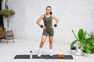 Woman in Sportswear Ready for Fitness Workout at Home Outdoor with Dumbbells Healthy Lifestyle...