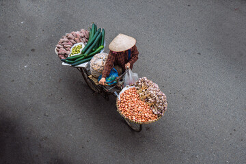 Vietnamese people selling things on the streets of Hanoi © Patrick.W