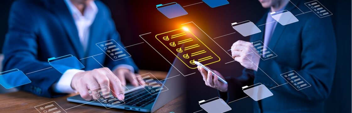 Businessman using laptop, mobile device to manage digital checklist and file system, cloud-based document workflow, data integration, smart organization and virtual collaboration for modern business - Powered by Adobe