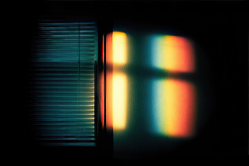Minimalist rainbow light pattern softly illuminates dark wall through window blinds, creating serene and dreamy atmosphere with subtle color gradients and abstract shapes