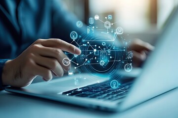 Person working on laptop with digital network overlay