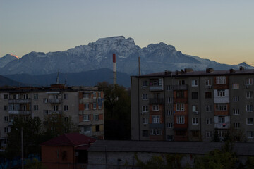 Apartment building with mountains in the background