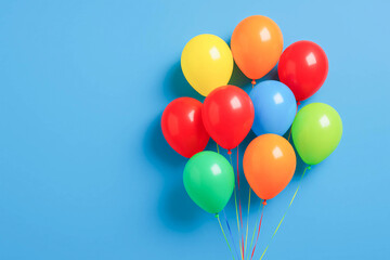 Bunch of Colorful Balloons on Blue Background with Copy Space