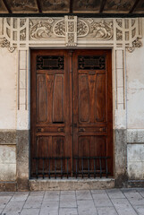 Elegant wooden doors with intricate and stunning architectural details