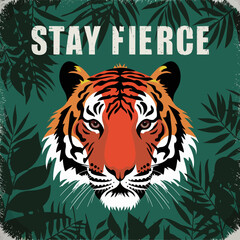 A powerful tiger face with the text stay fierce above it surrounded by dark green jungle leaves and foliage in a vintage style