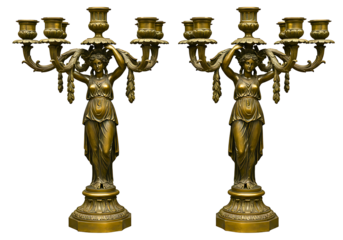 Pair of ornate antique bronze candelabra featuring female figures isolated on transparent background