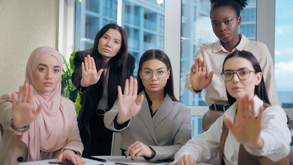 Strong serious multiethnic women females team girls African American Caucasian Japanese Muslim...