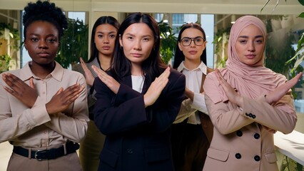 Negative strict serious multiethnic women females business colleagues team girls coworkers five...