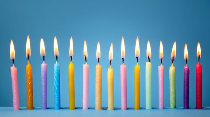 Colorful birthday candles with glowing flames, celebrating joy and festivity
