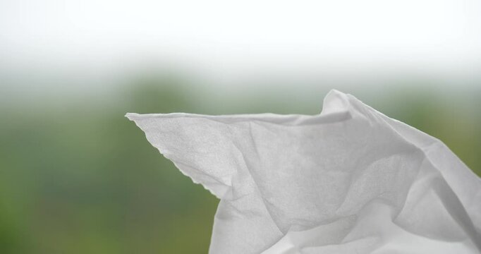 Tissues blowing in the wind, tissues against a natural background