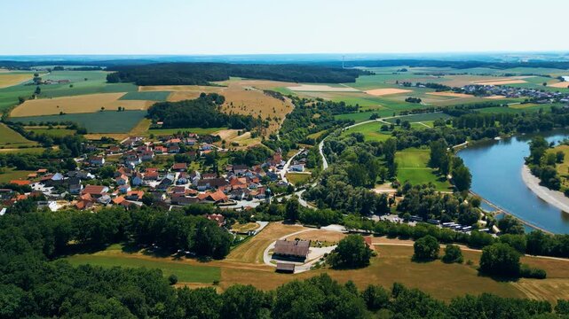 Kloster Weltenburg on the Danube River, Germany, shot from a drone in summer. Historic Benedictine monastery surrounded by forested cliffs and dramatic river curves near Kelheim