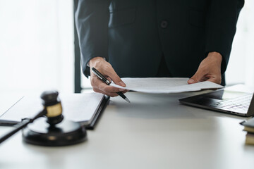 Justice lawyer considering a legal documents in courtroom