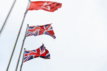 British and Hong Kong flags on white background