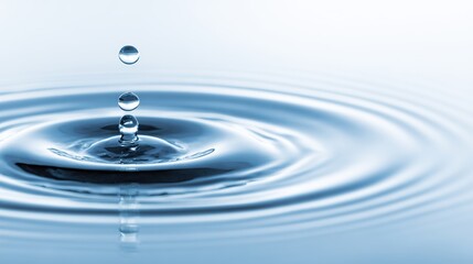 Close-Up of Water Droplet Falling into Calm Blue Waters, Creating Ripples and Circular Patterns on a White Background.