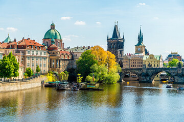 Fototapeta premium A view from the west bank of the Vltava river towards the Charles Bridge of Prague in springtime