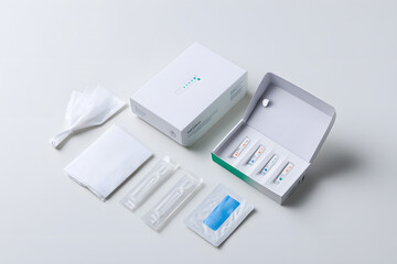 Complete at-home allergy testing kit with components laid out on white surface. Medical diagnostic concept with clean packaging and tools.