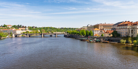 Panoramic view of Prague with Vltava River and historic bridges