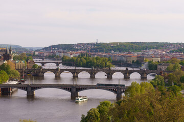 Fototapeta premium Panoramic view of Prague with Vltava River and historic bridges