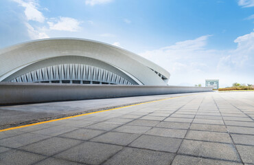 Empty road outside the modern building © xy