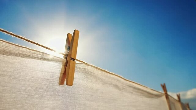 Wooden Clothes Peg peg clipping clothes on rope, natural breeze. Ai generated.