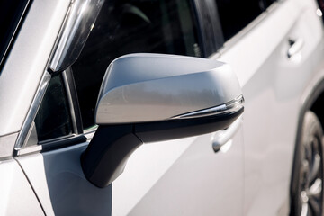 Close-up of a gray, new modern car outdoors. Concept of renting or buying a new car and modern...