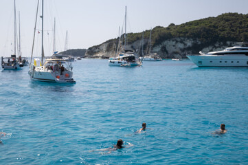 Blurred Boats and Swimmers in Aqua Bay
