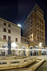 Brescia: the arengario and the INA Tower in Vittoria square. Lombardy, Italy.