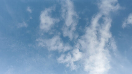 blue sky with white clouds. The sky is clear and bright, clear blue sky with few clouds