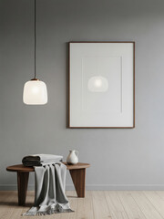 Mockup poster frame hanging on gray wall above wooden bench with blanket and ceramic jug in minimalist interior