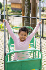Obraz premium Daughter playing in backyard playground