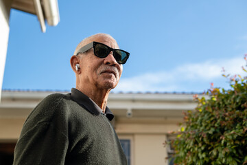 Senior man seen standing outdoors