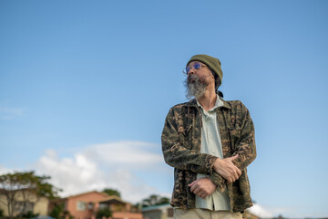 Portrait of man seen standing outdoors