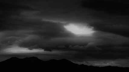Background of stormy sky and mountain silhouette